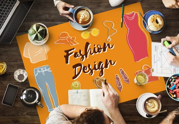 Table with poster with Fashion Design