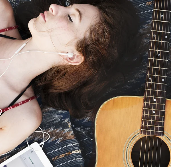 Girl in earphones on Beach