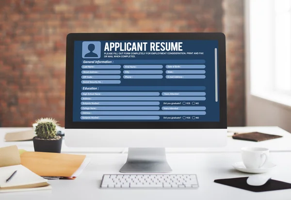 Computer with Applicant Resume on Screen
