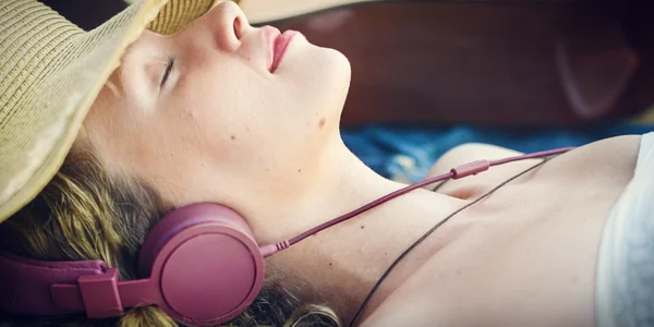 Woman listening music and dreaming