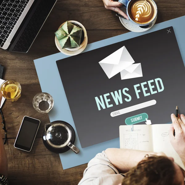 Table with poster with News Feed