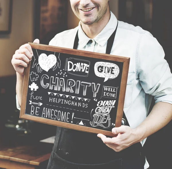 Barista holding board with text