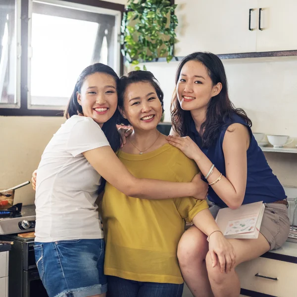 Happy asian family in kitchen