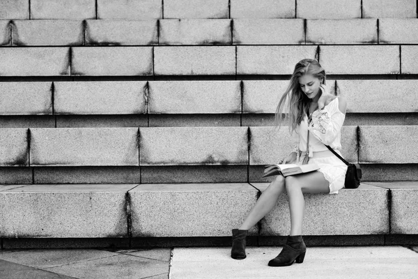 Girl writing Songs in notebook