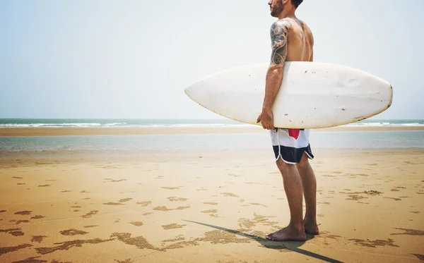 Man on Beach with Surfing board