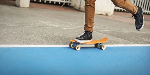 Skateboarder riding in street