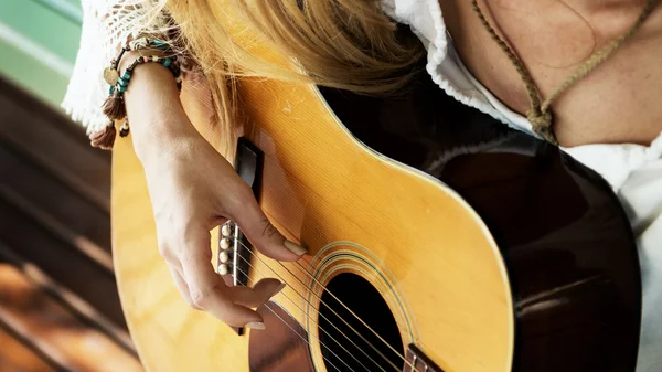 Girl playing on guitar