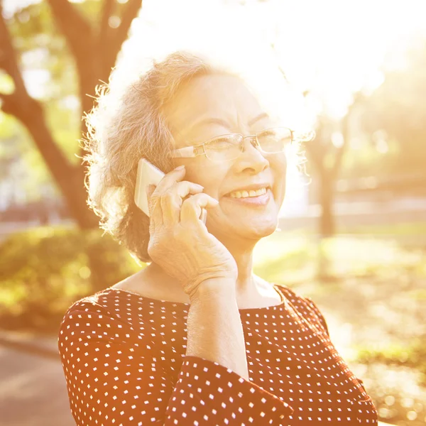 Elderly woman using phone