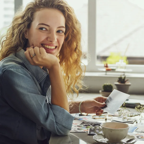 Lady holding Photograph