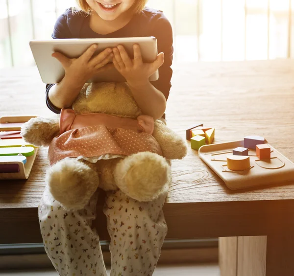 Little Girl holding digital tablet