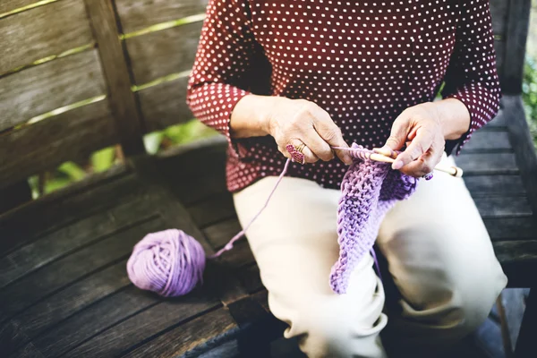 Woman Knitting Scarf