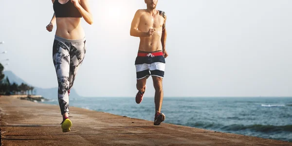 People doing sport exercises at beach