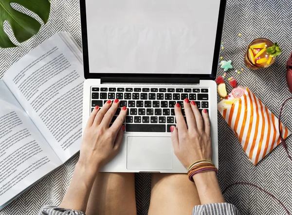 Woman in vacation working with laptop