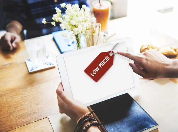 Woman in cafe holding tablet pc