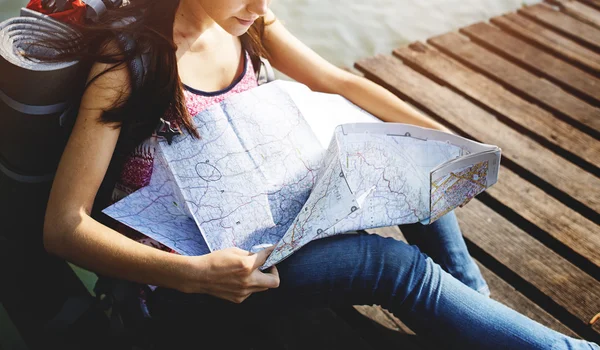 Cute girl reading map