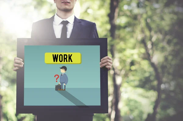 Businessman holding board in nature