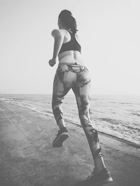 Woman jogging on beach