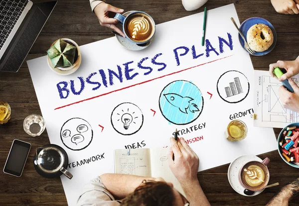 Table with poster with Business Plan concept