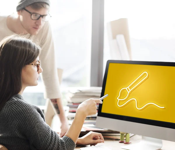 Woman showing on monitor with paint