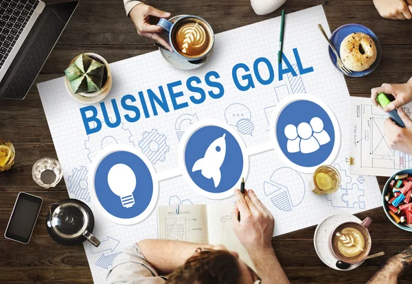 Table with poster with Business Goal concept