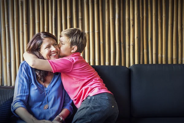 Son Kissing Mother and Hugging