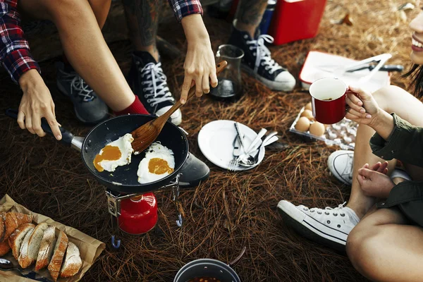 Best friends cooking outdoors