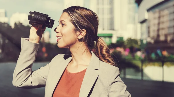 Businesswoman with Binocular at street