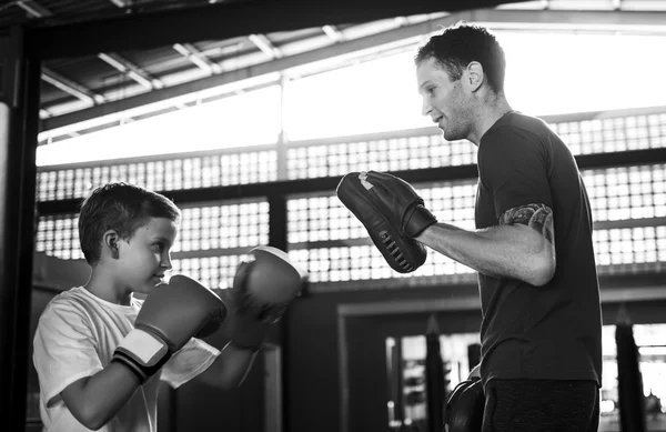 Boy Training Boxing with teacher