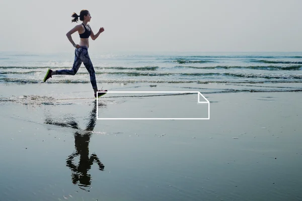 Woman in leggings running on beach