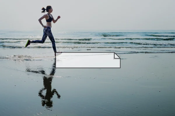 Woman in leggings running on beach