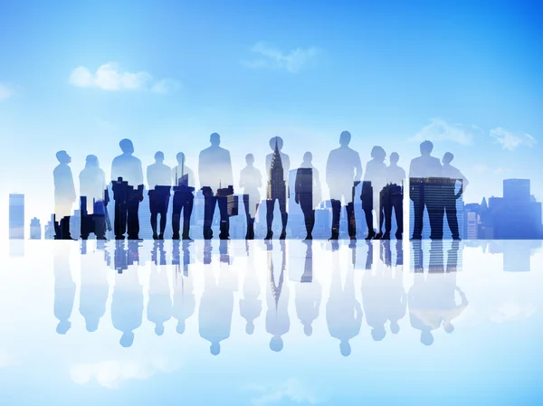 Silhouettes of Business People on a City Scape Looking Up