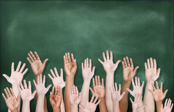 Hands Raised with Blackboard