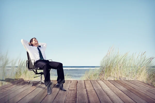 Businessman Relaxing at Beach