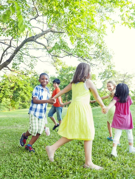 Children dancing in park