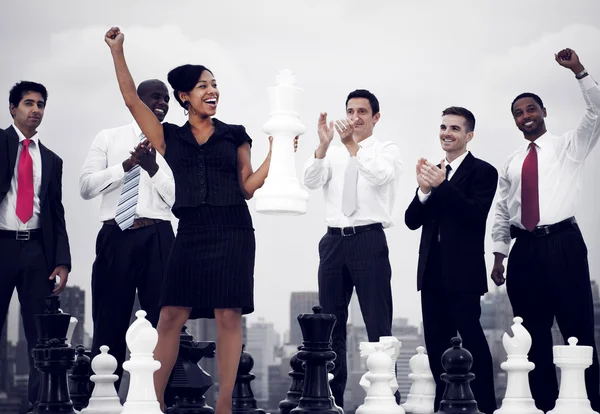 Business People Winning Chess Game