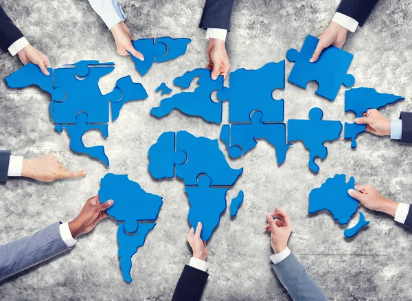 Business People Forming World Map