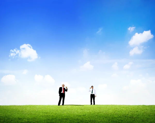 Two business men standing outdoors