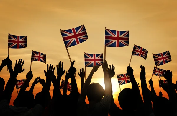 People Waving UK Flags
