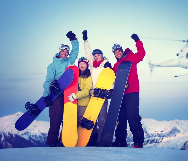 Snowboarders on top of mountain