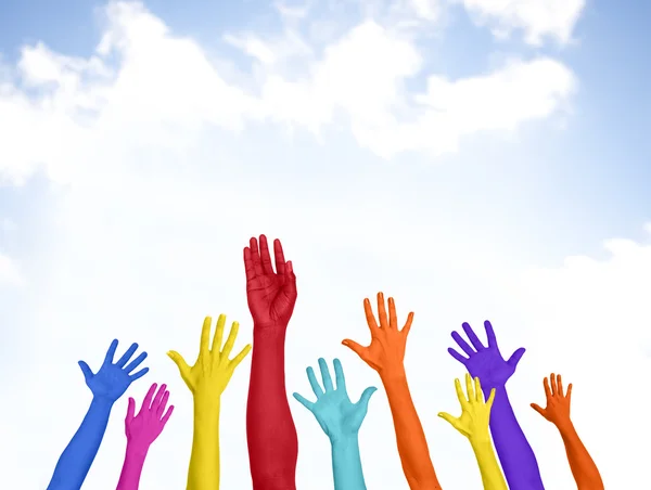 Colorful Hands on sky background