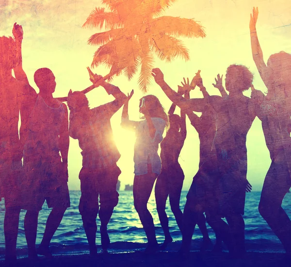 People celebrate at a party on a tropical island