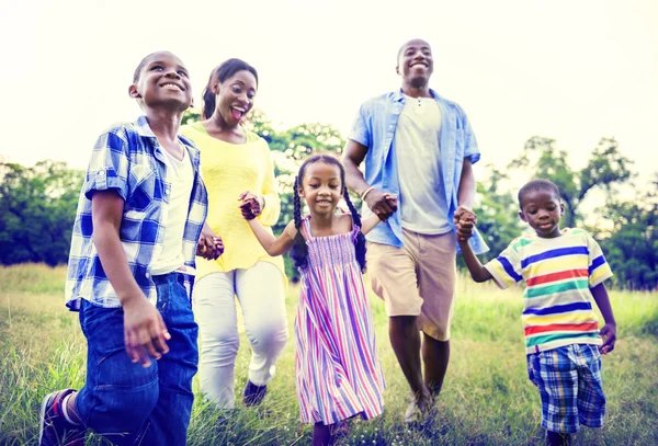 African American family relaxes on the nature