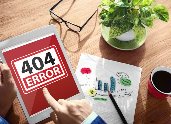 Man Using a Digital Tablet with 404 Error