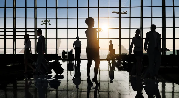 Silhouettes of business people in the airport