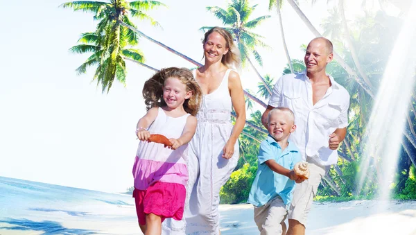 Happy Family looking Playful at Vacation Concept