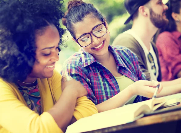 Diverse college students studying in classroom