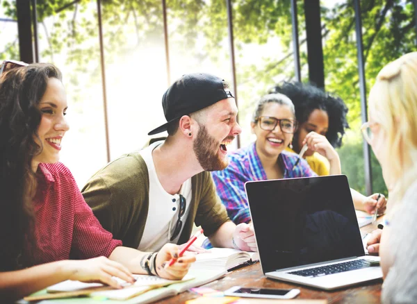 Diverse college students brainstorming in classroom