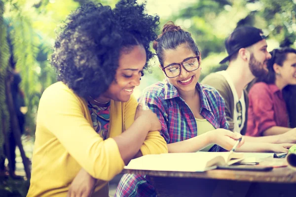 Diverse college students studying in classroom