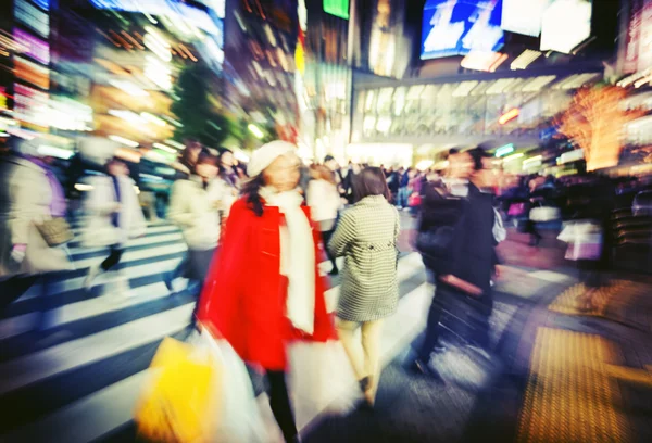 People walking across street