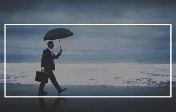 Businessman with Frame umbrella walking.